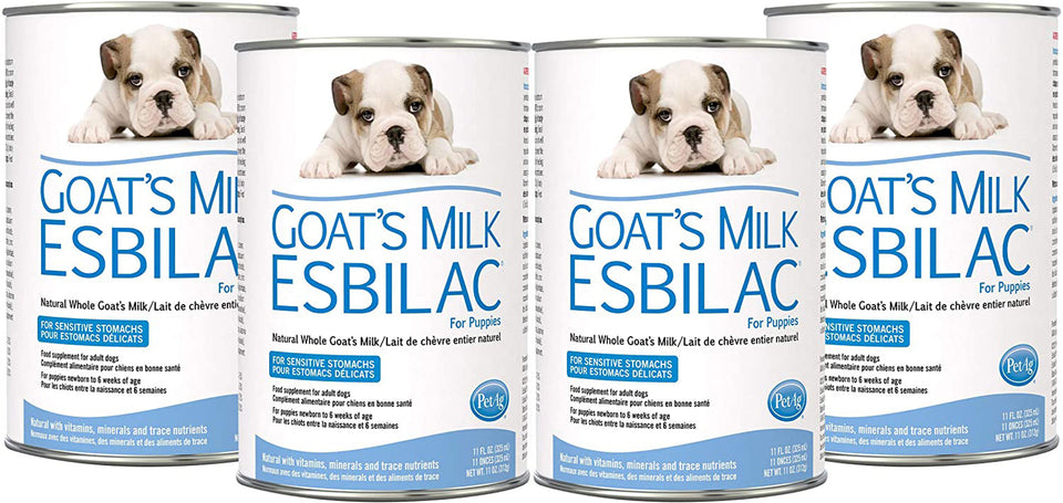 Four cans of Pet-Ag Goat's Milk Esbilac for puppies, featuring a white and brown bulldog puppy on the label.