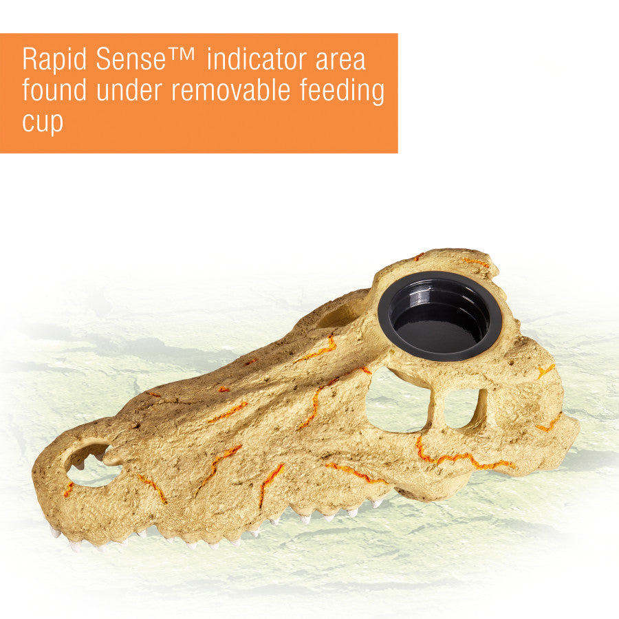 Large crocodile skull decor with a black feeding cup, showing orange "Rapid Sense" indicator lines.