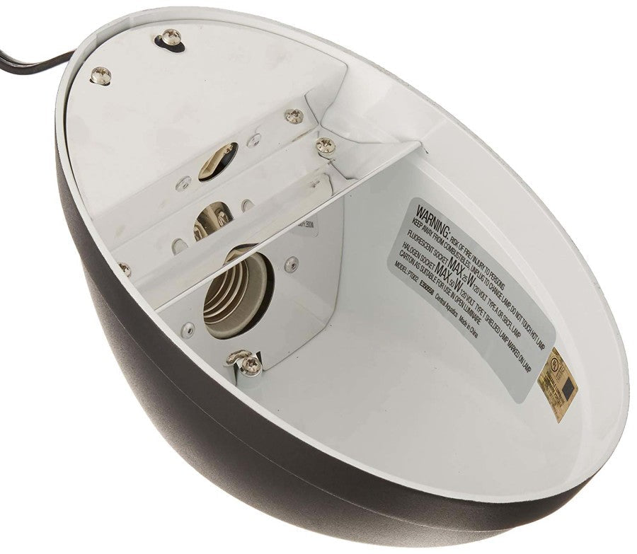 Underside of a black Zilla basking fixture, showing two bulb sockets and a warning label.