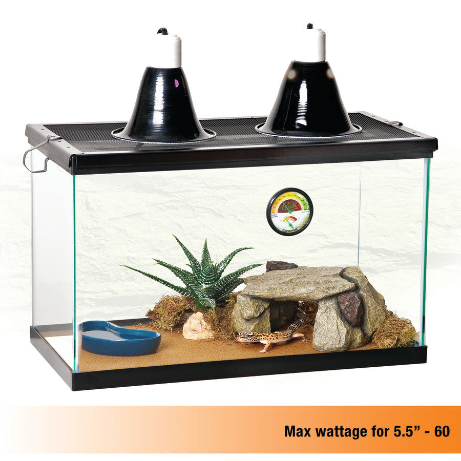A Zilla Premium Reflector Dome kit with two black domes on a glass terrarium, housing a gecko, plant, and rock hide.
