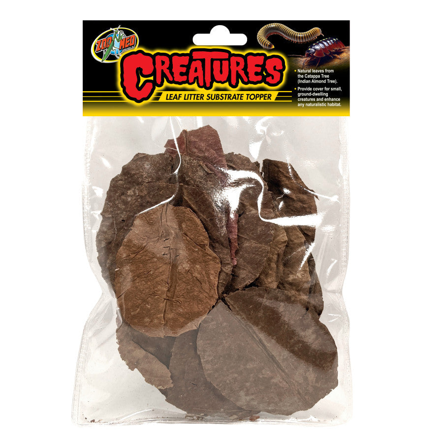 Clear bag of Zoo Med Creatures Leaf Litter, showing various brown dried leaves, with a black and yellow label.