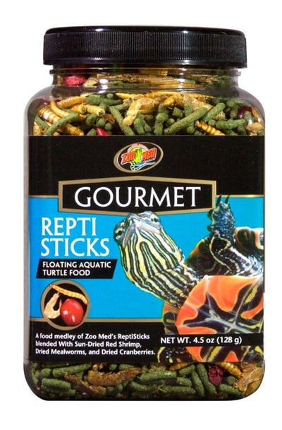 Zoo Med Gourmet Repti Sticks turtle food in a clear jar, showing green sticks, dried mealworms, and red cranberries.