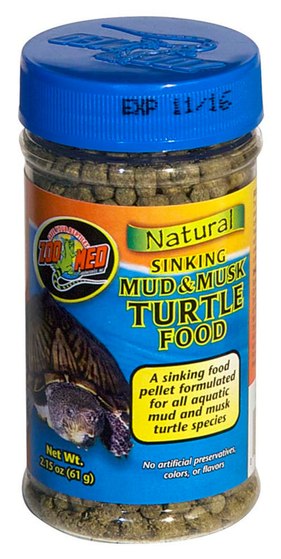 Blue-capped clear jar of Zoo Med turtle food, showing a turtle on the label and an expiration date of 11/15.