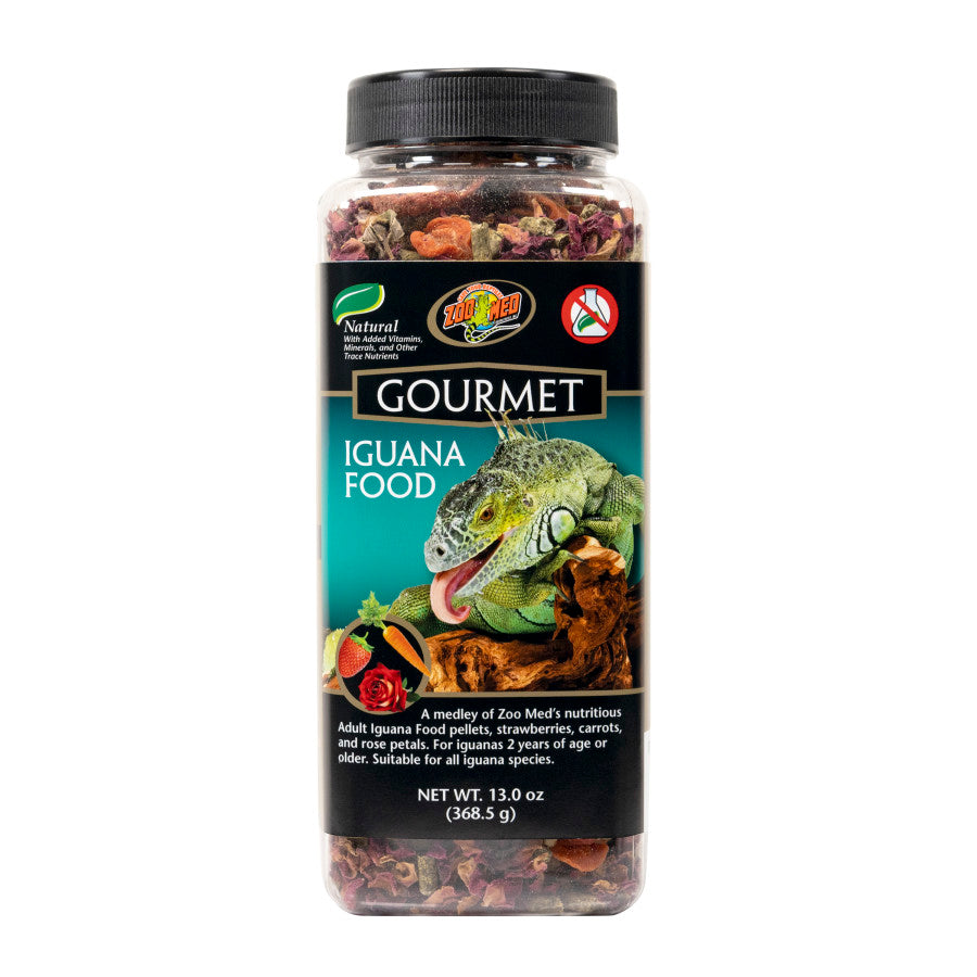 Clear plastic jar of Zoo Med Gourmet Iguana Food with a black label featuring an iguana, strawberries, carrots, and rose peta
