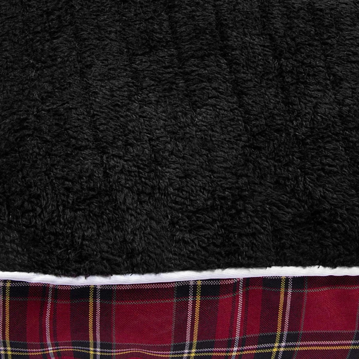 Close-up of the plush black and red plaid fabric of the Round Dog Bed - Plush Red Plaid Cuddler Bed with Removable Washable Cover