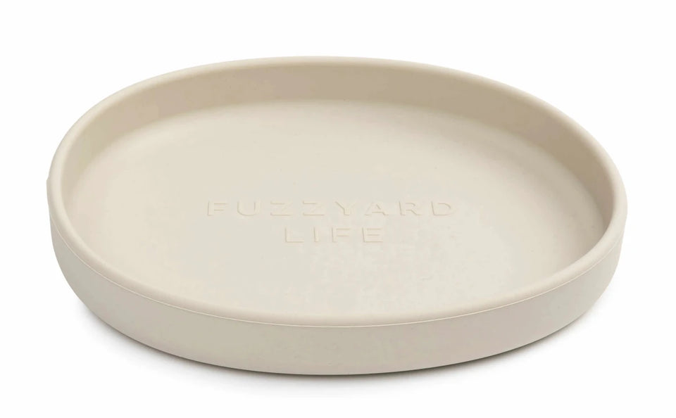 Cream FuzzYard Life shallow silicone cat dish, angled front view