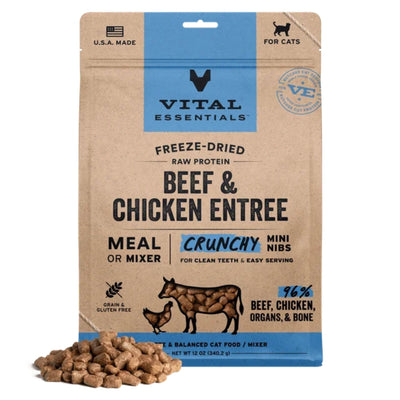 Brown and blue bag of Vital Essentials freeze-dried cat food with a pile of kibble in front.