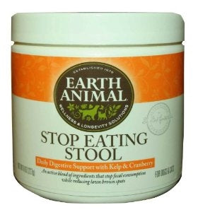 Round tub of Earth Animal Stop Eating Stool digestive support powder with orange label
