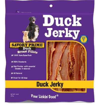 Purple bag of Savory Prime Duck Jerky dog treats with three dogs and a window showing the jerky.
