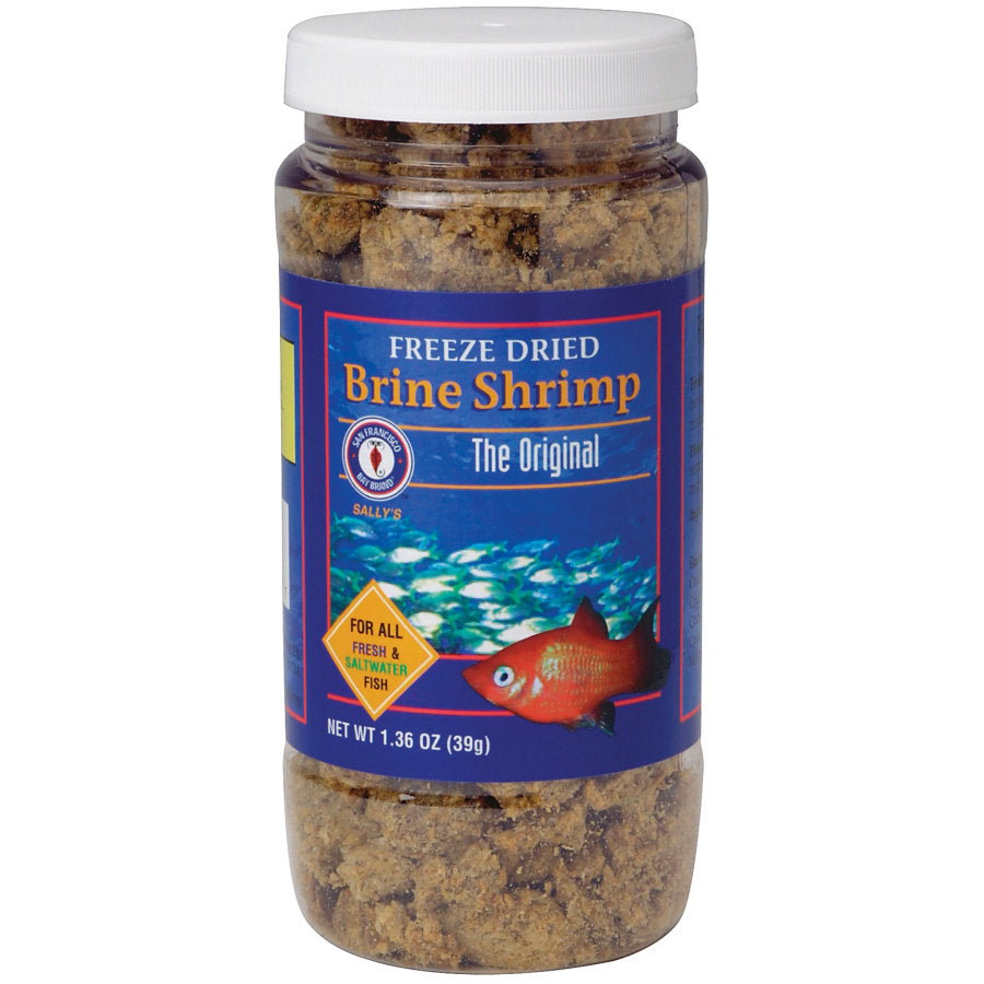 Clear jar of San Francisco Bay Brand Freeze-Dried Brine Shrimp, showing brown flakes and a blue label with fish.