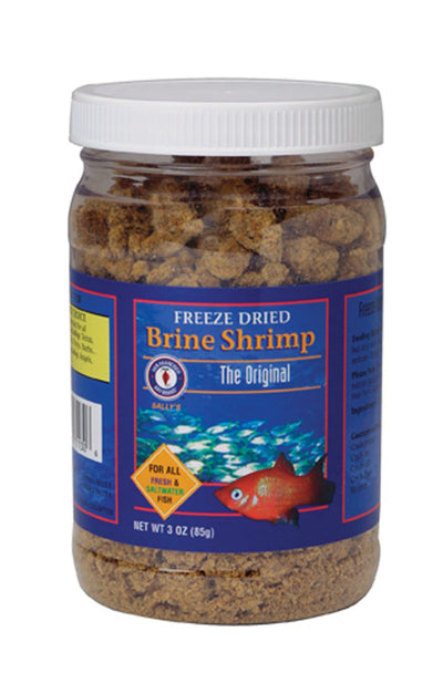Clear jar of San Francisco Bay freeze-dried brine shrimp fish food with a blue label, showing a red fish and small blue fish.