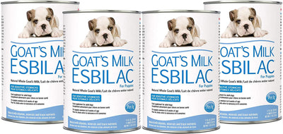 Four cans of Pet-Ag Goat's Milk Esbilac for puppies, featuring a white and brown bulldog puppy on the label.