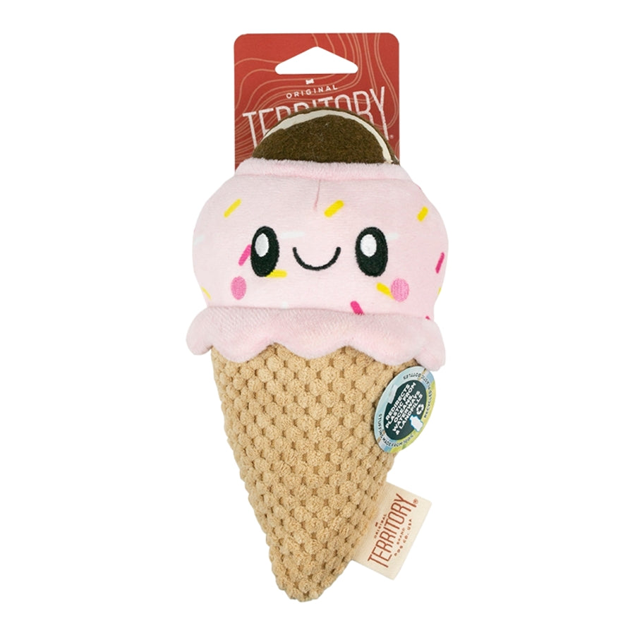 Plush dog toy shaped like a smiling pink ice cream cone with sprinkles, hanging from a red "Territory" brand tag.