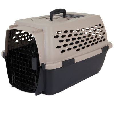 Taupe and black pet carrier with a metal grate door, ventilation holes, and a black handle on top, angled right.