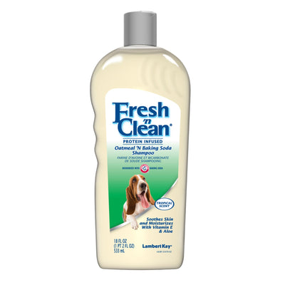 Cream bottle with basset hound on Oatmeal 'N Baking Soda Pet Shampoo label, green accent