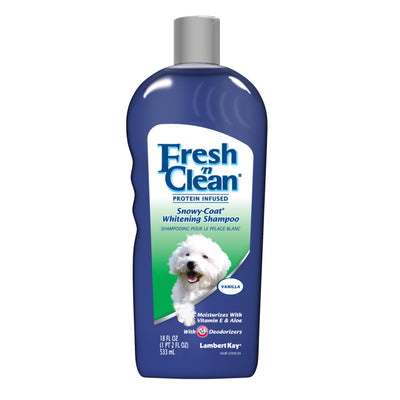 Navy blue bottle with fluffy white dog on Snowy Coat Whitening Shampoo label, vanilla scent badge