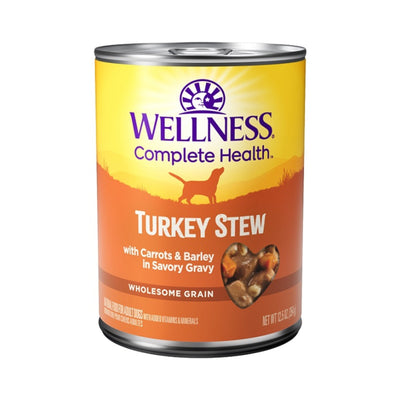 Front view of a Wellness Complete Health Turkey Stew dog food can, showing a heart-shaped cutout of the stew.