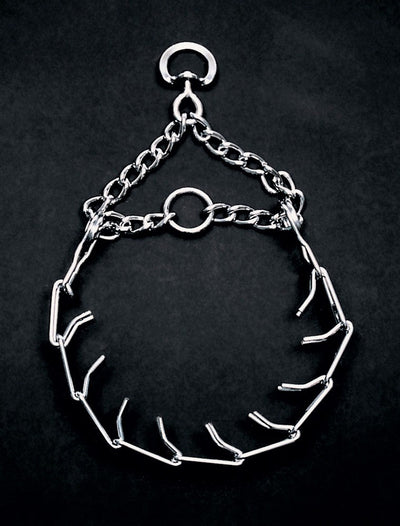 Shiny chrome prong collar for dog training, laid flat on a dark background, showing its full length and construction.