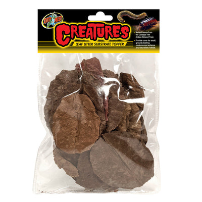 Clear bag of Zoo Med Creatures Leaf Litter, showing various brown dried leaves, with a black and yellow label.
