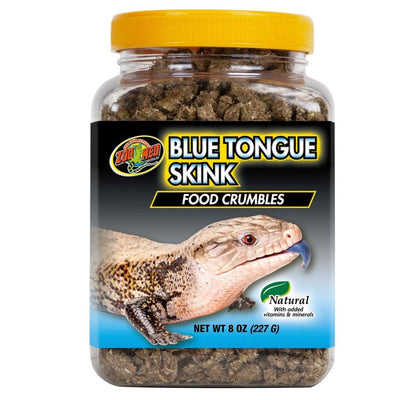 Zoo Med Blue Tongue Skink Food Crumbles in a clear jar with a yellow lid, showing a skink on the label.