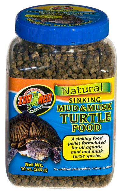 Clear jar of Zoo Med Natural Sinking Mud & Musk Turtle Food, showing dark pellets and a blue-labeled turtle.