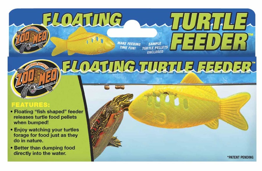 Packaging for a yellow fish-shaped floating turtle feeder, with a turtle interacting with the feeder in water.