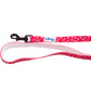Cutie Ties Fun Design Dog Leash in pink with white paw prints and a black clip for secure pet walks