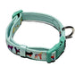Dog Collar in light blue with colorful dog silhouettes and plastic buckle for adjustable fit and metal D-ring attachment