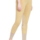 Woman wearing beige TuffRider Ladies Pull-On Knee Patch Breeches standing barefoot on white background
