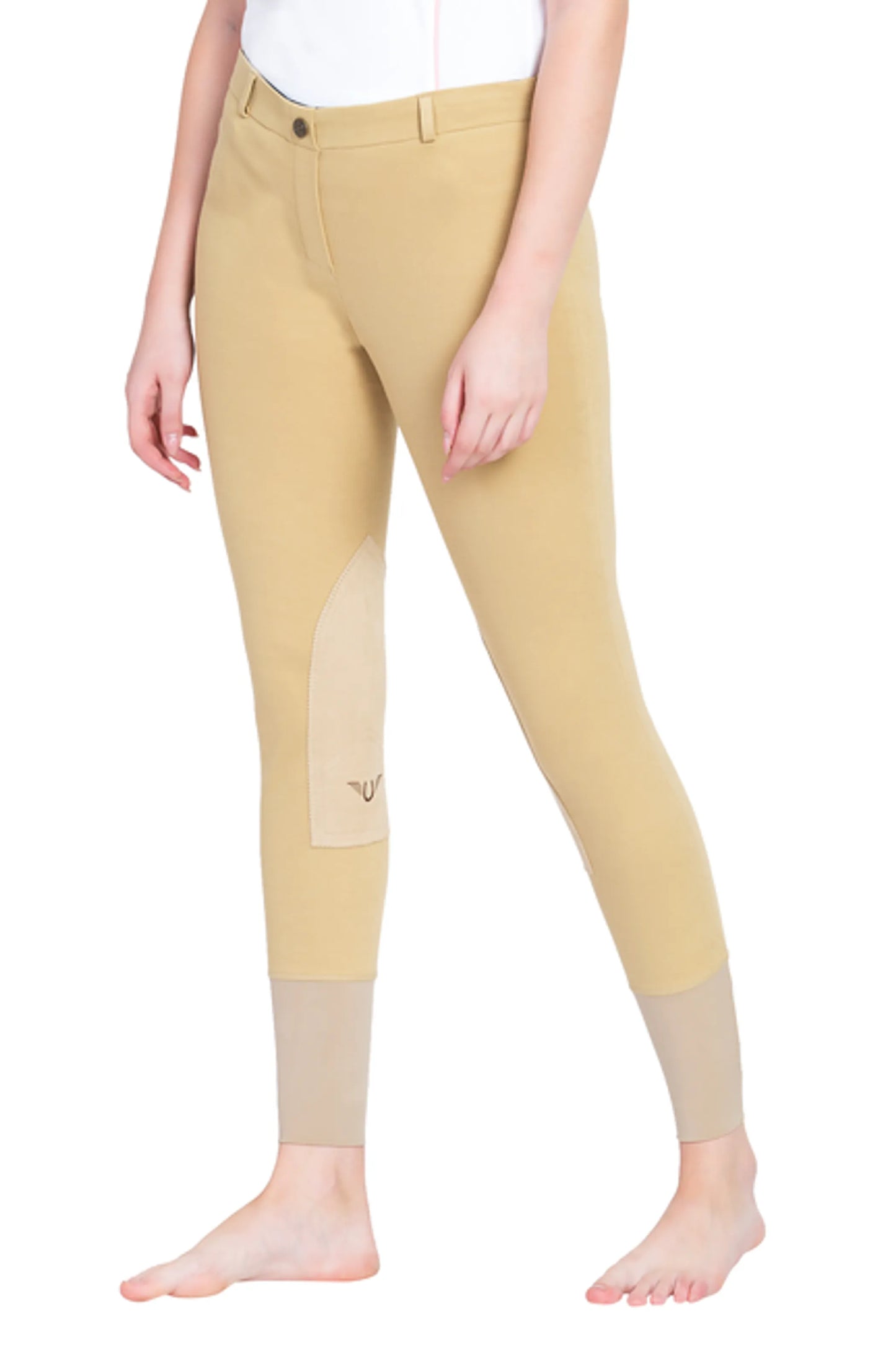 Woman wearing tan TuffRider Ladies Pull-On Knee Patch Breeches standing barefoot against white background