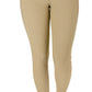 Woman wearing tan TUFFRIDER LADIES CLASSIC RIBBED TIGHTS standing barefoot with hands adjusting garment waistband