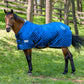 Brown horse wearing a blue quilted blanket in a grassy area with trees TuffRider Kozy Komfort Two Stable Blanket-420 D 200 GSM of fill- Black- 69
