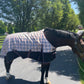 TuffRider Turnout Comfy 1200 D Medium Weight 200 GSM Standard Neck Blanket- Beige and Black Plaid- 69 on horse outdoors in sunny area