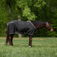 Horse wearing TuffRider Shelter Closed Front Stable Sheet-Black/Grey-68 standing in grassy field with trees behind.