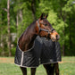 Horse wearing TuffRider Shelter Closed Front Medium Weight Stable Blanket-Black/Grey-68 in grassy outdoor setting