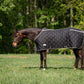 Horse wearing TuffRider Shelter Closed Front Heavyweight Stable Blanket-Black/Grey-72 in grassy field with trees background