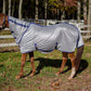 Horse outdoors wearing a silver TuffRider Comfy Plus Combo Neck Fly Sheet in a fenced grassy area