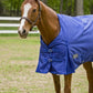 Chestnut horse wearing a blue TuffRider 1680 D Super Comfy Detachable Neck Blanket in a green pasture