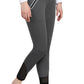 Woman wearing dark gray TUFFRIDER LADIES YETI SOFT SHELL KNEE PATCH BREECHES with zippered pockets and ankle mesh panels