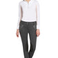 Woman wearing TUFFRIDER LADIES YETI SOFT SHELL KNEE PATCH BREECHES in dark gray with white long-sleeve top, posing.