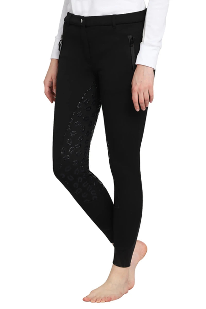 Woman wearing black TUFFRIDER LADIES MACY WINTER BREECHES with zippered pockets and grip detail on inner leg