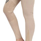 Close-up of beige TUFFRIDER LADIES PINTA TIGHTS with grip patches and stylish black stripe details on the leg