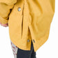 Close-up of yellow jacket with snap buttons on sleeve cuff and side vent detail TuffRider Children's Little Trotter Jacket