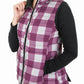 Woman wearing a purple and white checkered TuffRider Ladies Combination Reversible Vest with black long sleeves underlayer