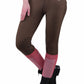 Woman wearing brown and pink TuffRider Ladies Ventilated Schooling Tights with black riding boots on white background