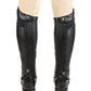 TuffRider Men's Derby Half Chaps in black leather shown on legs with beige riding pants, equestrian gear for horse riding.