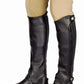 TuffRider Adult Grippy Grain Half Chaps Tall in black worn over beige riding pants for equestrian use