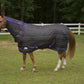 Horse wearing TUFFRIDER KOZY KOMFORT COMBO STABLE BLANKET- NAVY, 69 in a grassy fenced paddock area