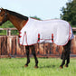 Horse wearing white and red TuffRider Power Mesh Fly Sheet standing on green grass near wooden fence outdoors