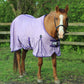 Horse wearing a lavender TuffRider Power Mesh Fly Sheet standing outdoors near a wooden fence in green pasture